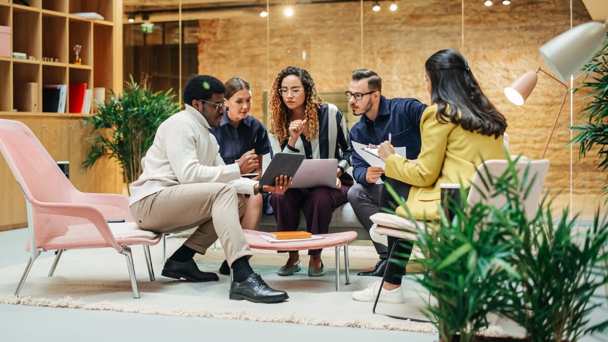 Group of marketers discussing data insights and trend
