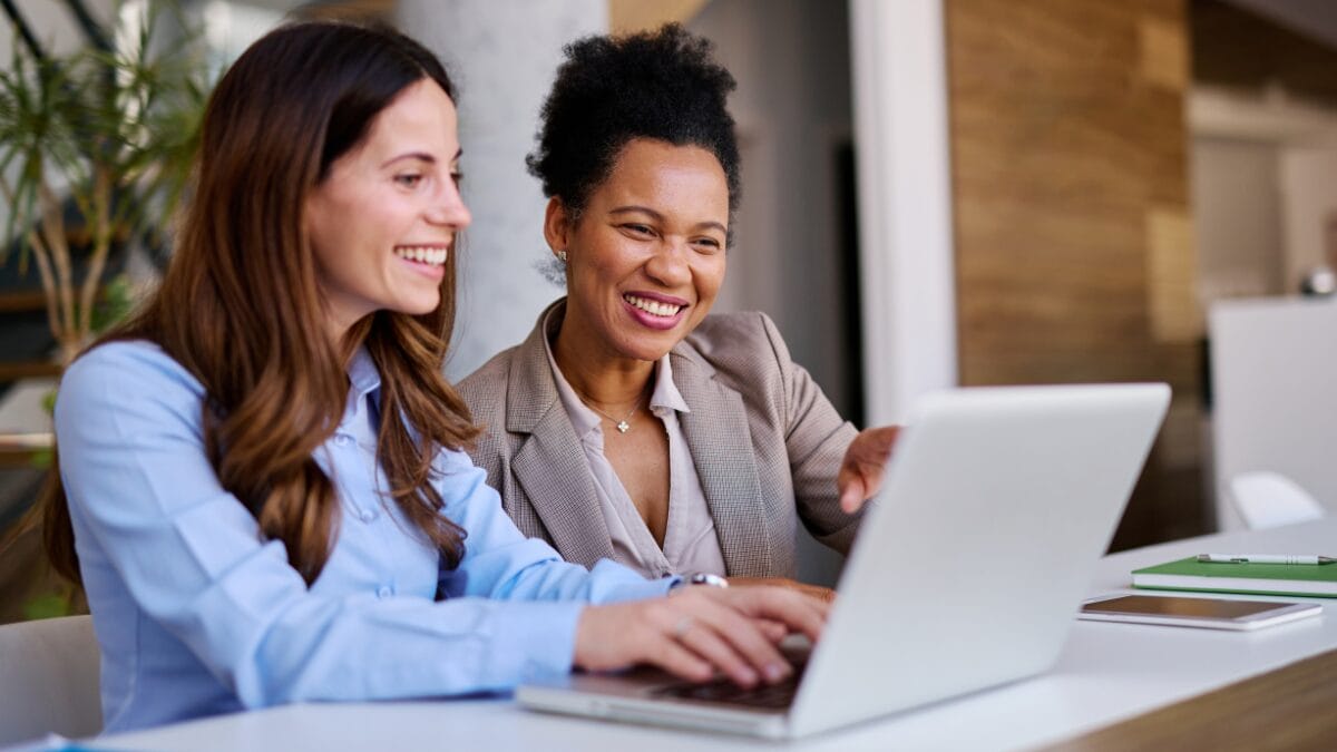 Marketer and customer success manager working together