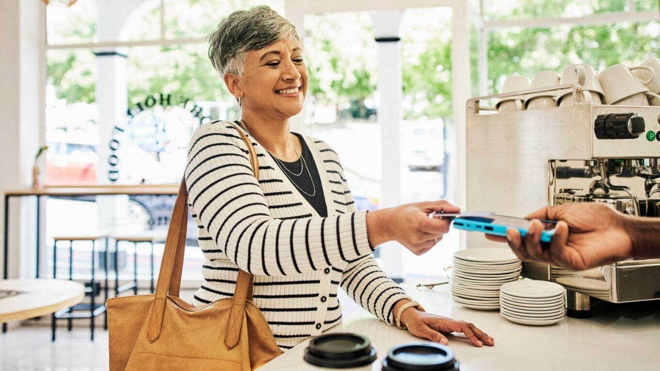 Shopper using loyalty rewards card in-store