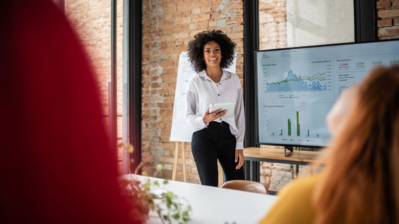 Young professional using martech stack to present revenue growth