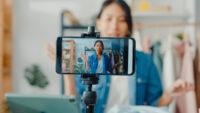 user generated content social media woman making a video using smartphone