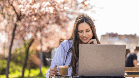 Marketer reading Dotdigital’s social media calendar for May 2025.